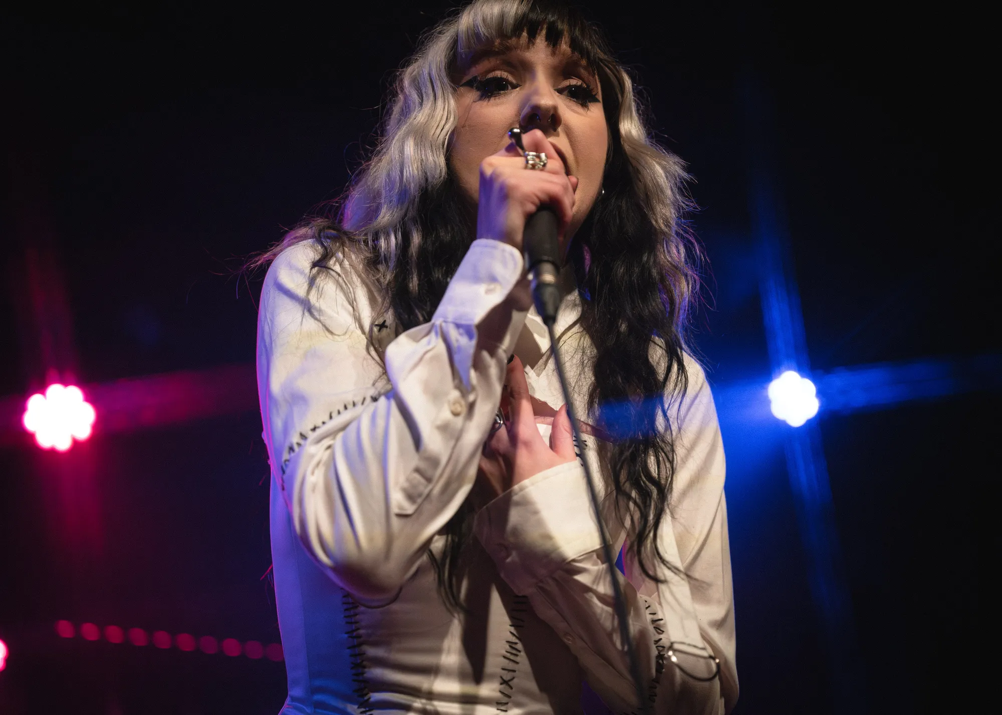 FKA Rayne on stage under crossing light beams at the Wise Hall, 2026. Live photo by Spencer Nakamura.